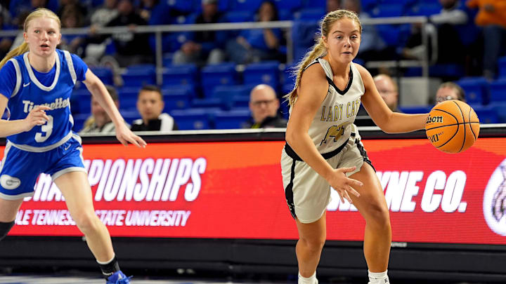 Wayne County's Victoria Brison (14) dribbles past Gordonsville's Lanie Foster (3) during the third quarter of a Class 1A TSSAA state quarterfinal game at the Murphy Center in Murfreesboro, Tenn., Thursday, March 12, 2026.