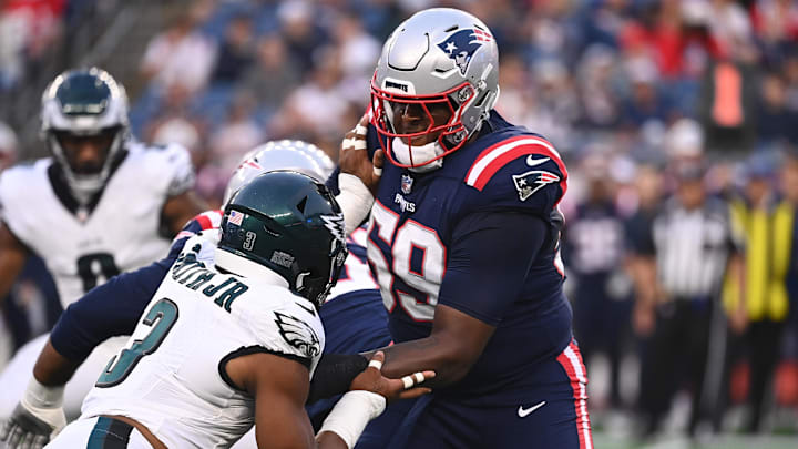 Aug 15, 2024; Foxborough, MA, USA; New England Patriots offensive tackle Vederian Lowe (59) blocks Philadelphia Eagles linebacker Nolan Smith Jr. (3) during the first half at Gillette Stadium. Mandatory Credit: Eric Canha-Imagn Images