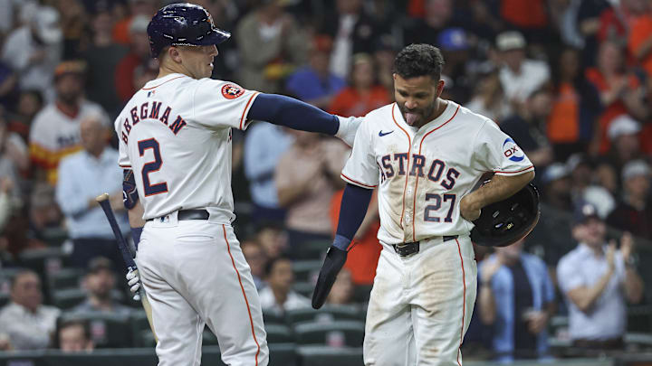 Apr 3, 2024; Houston, Texas, USA; Houston Astros second baseman Jose Altuve (27) reacts with third baseman Alex Bregman (2) after scoring a run during the fourth inning against the Toronto Blue Jays at Minute Maid Park. Apr 3, 2024; Houston, Texas, USA; Houston Astros second baseman Jose Altuve (27) reacts with third baseman Alex Bregman (2) after scoring a run during the fourth inning against the Toronto Blue Jays at Minute Maid Park.