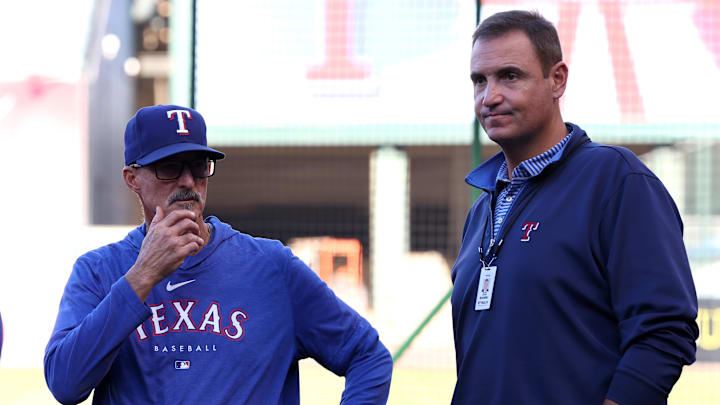 Sep 28, 2024; Anaheim, California, USA;  Texas Rangers pitching coach Mike Maddux (31) talks with general manager Chris Young (right) prior to a game against the Los Angeles Angels at Angel Stadium.