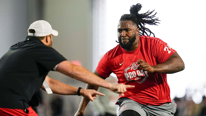 Ohio State Buckeyes offensive lineman Donovan Jackson (74) works out with current Ohio State offensive line coach Tyler Bowen during the pro day for NFL scouts at the Woody Hayes Athletic Cente on March 26, 2025.