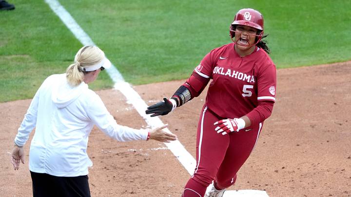 Oklahoma's Ella Parker (5) celebrates a home run with head coach Patty Gasso during the college softball game between the Oklahoma Sooners and the Georgia Bulldogs at Love's Field in Norman, Okla., Saturday, April, 25, 2026.
