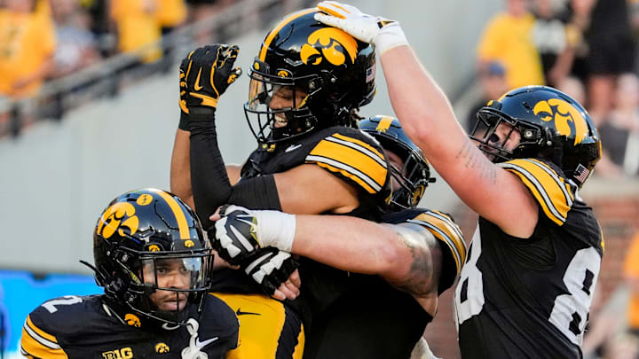 Iowa Hawkeyes wide receiver Seth Anderson (6) is lifted into the air as teammates celebrate his touchdown with him during a football game against the Massachusetts Minutemen Sept. 13, 2025 at Kinnick Stadium in Iowa City, Iowa.