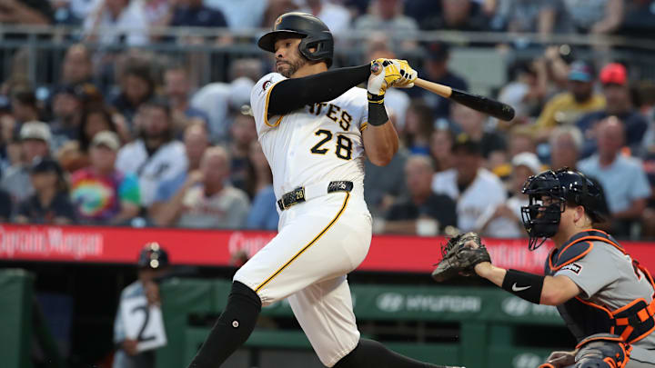 Jul 22, 2025; Pittsburgh, Pennsylvania, USA;  Pittsburgh Pirates left fielder Tommy Pham (28) hits an RBI double against the Detroit Tigers during the sixth inning at PNC Park. Mandatory Credit: Charles LeClaire-Imagn Images