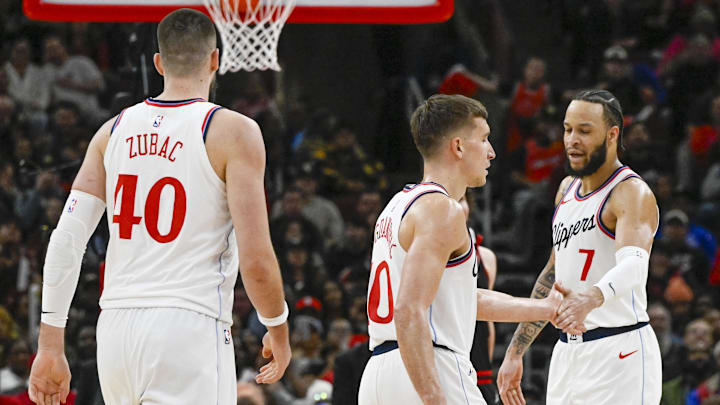 Feb 26, 2025; Chicago, Illinois, USA;  LA Clippers guard Bogdan Bogdanovic (10) and LA Clippers guard Amir Coffey (7) high five during the second half against the Chicago Bulls  at the United Center. Mandatory Credit: Matt Marton-Imagn Images