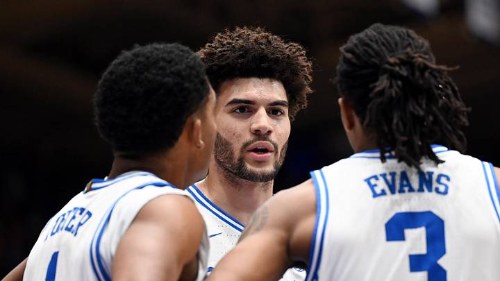 Feb 14, 2026; Durham, North Carolina, USA; Duke basketball forward Cameron Boozer (12) huddles with teammates Caleb Foster (1) and Isaiah Evans (3) during the first half against the Clemson Tigers at Cameron Indoor Stadium.