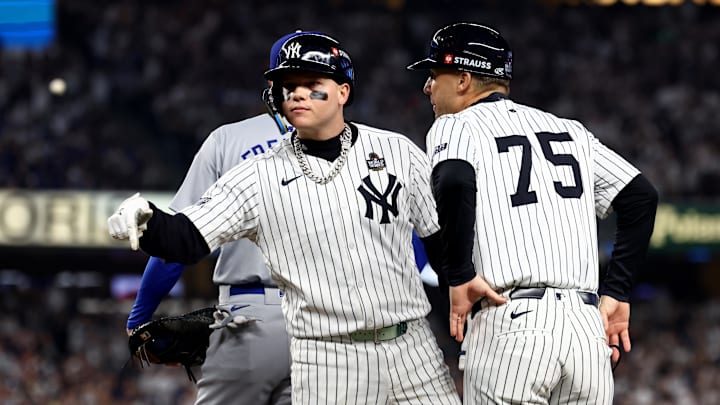 Oct 30, 2024; New York, New York, USA; New York Yankees outfielder Alex Verdugo (24) celebrates with first base coach Travis Chapman (75) after hitting a RBI single during the second inning against the Los Angeles Dodgers in game five of the 2024 MLB World Series at Yankee Stadium. Mandatory Credit: Vincent Carchietta-Imagn Images Oct 30, 2024; New York, New York, USA; New York Yankees outfielder Alex Verdugo (24) celebrates with first base coach Travis Chapman (75) after hitting a RBI single during the second inning against the Los Angeles Dodgers in game five of the 2024 MLB World Series at Yankee Stadium. Mandatory Credit: Vincent Carchietta-Imagn Images