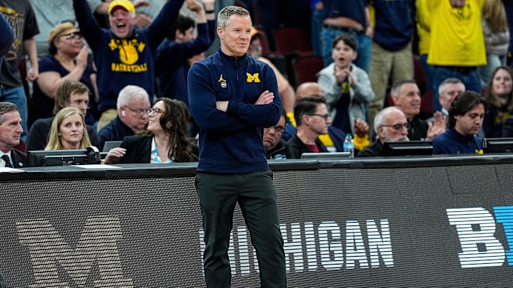 Michigan head coach Dusty May smiles after a play against Tennessee during the second half of NCAA Tournament Elite 8 round at United Center in Chicago on Sunday, March 29, 2026.