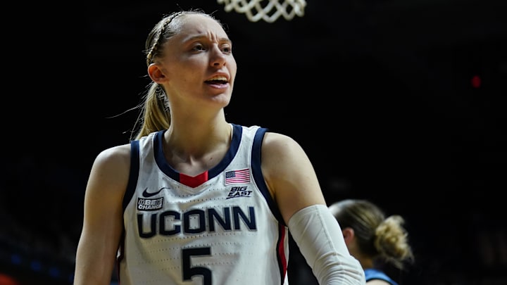 Mar 10, 2024; Uncasville, CT, USA; UConn Huskies guard Paige Bueckers (5) reacts after blocking the shot of Marquette Golden Eagles guard Jordan King (23) in the second half at Mohegan Sun Arena. Mandatory Credit: David Butler II-Imagn Images