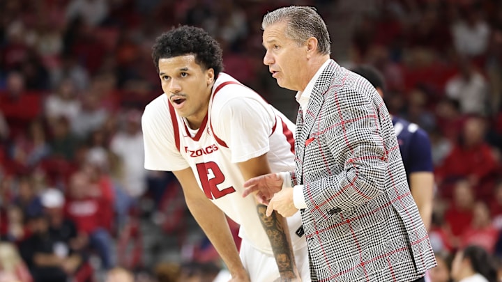 Arkansas Razorbacks forward Malique Ewin (12) receives guidance from head coach John Calipari during the second half against the Jackson State Tigers at Bud Walton Arena. Arkansas won 115-61. Arkansas Razorbacks forward Malique Ewin (12) receives guidance from head coach John Calipari during the second half against the Jackson State Tigers at Bud Walton Arena. Arkansas won 115-61.