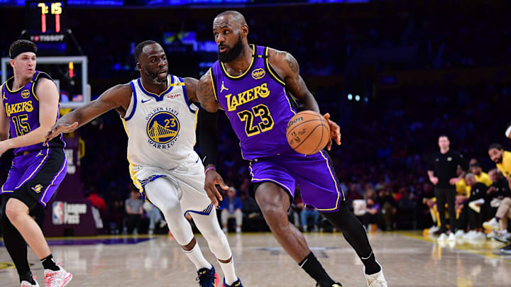 Feb 6, 2025; Los Angeles, California, USA; Los Angeles Lakers forward LeBron James (23) moves the ball against Golden State Warriors forward Draymond Green (23) during the first half at Crypto.com Arena. Mandatory Credit: Gary A. Vasquez-Imagn Images Feb 6, 2025; Los Angeles, California, USA; Los Angeles Lakers forward LeBron James (23) moves the ball against Golden State Warriors forward Draymond Green (23) during the first half at Crypto.com Arena. Mandatory Credit: Gary A. Vasquez-Imagn Images