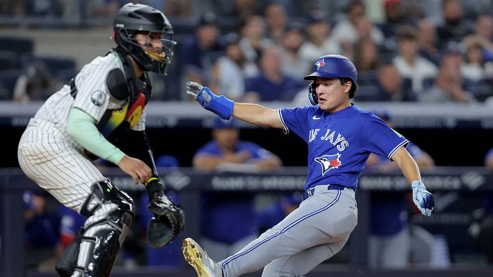 Toronto Blue Jays center fielder Brett Bateman (21) scores a run against New York Yankees catcher Ali Sanchez (39) on a single by catcher Alejandro Kirk (not pictured). Credit: Brad Penner-Imagn Images Toronto Blue Jays center fielder Brett Bateman (21) scores a run against New York Yankees catcher Ali Sanchez (39) on a single by catcher Alejandro Kirk (not pictured). Credit: Brad Penner-Imagn Images