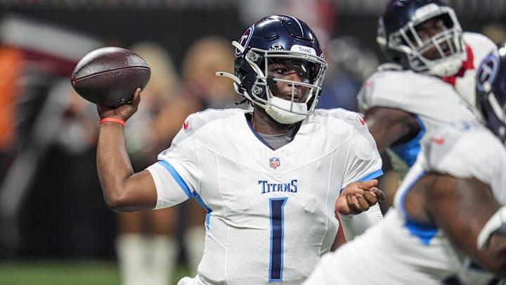 Aug 15, 2025; Atlanta, Georgia, USA; Tennessee Titans quarterback Cameron Ward (1) passes the ball against the Atlanta Falcons during the first half at Mercedes-Benz Stadium. Mandatory Credit: Dale Zanine-Imagn Images