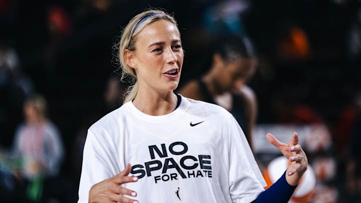 Indiana Fever guard Sophie Cunningham (8) talks with her teammates before the game against the Washington Mystics at Entertainment & Sports Arena.