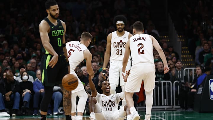 Feb 28, 2025; Boston, Massachusetts, USA; Cleveland Cavaliers guard Darius Garland (10) smiles as he is helped up by teammates after Boston Celtics forward Jayson Tatum (0) was called for an offensive foul during the second half at TD Garden. Mandatory Credit: Winslow Townson-Imagn Images