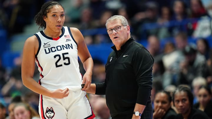 Nov 8, 2023; Hartford, Connecticut, USA; UConn Huskies head coach Geno Auriemma talks with forward Ice Brady (25) from the sideline as they take on the Dayton Flyers at XL Center. Mandatory Credit: David Butler II-Imagn Images