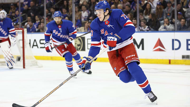 Apr 17, 2025; New York, New York, USA;  New York Rangers center Matt Rempe (73) controls the puck in the second period against the Tampa Bay Lightning at Madison Square Garden. Mandatory Credit: Wendell Cruz-Imagn Images