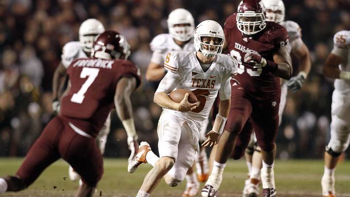 Texas Longhorns quarterback Case McCoy runs the ball against the Texas A&M Aggies in the fourth quarter at Kyle Field. Texas defeated Texas A&M 27-25.  