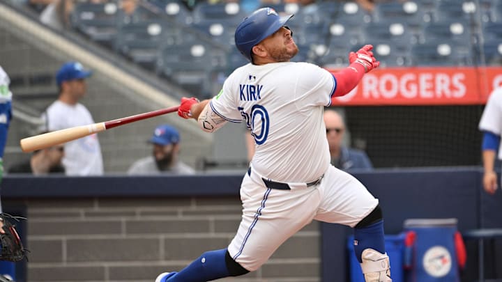 Jun 19, 2025; Toronto, Ontario, CAN;  Toronto Blue Jays catcher Alejandro Kirk (30) hits a solo home run against the Arizona Diamondbacks in the eighth inning at Rogers Centre.