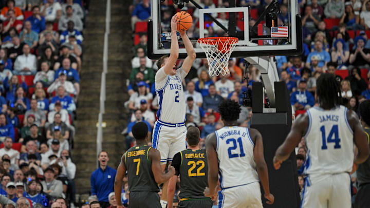 Mar 23, 2025; Raleigh, NC, USA; Duke Blue Devils forward Cooper Flagg (2) dunks the ball during the first half against the Baylor Bears in the second round of the NCAA Tournament at Lenovo Center. Mandatory Credit: Zachary Taft-Imagn Images