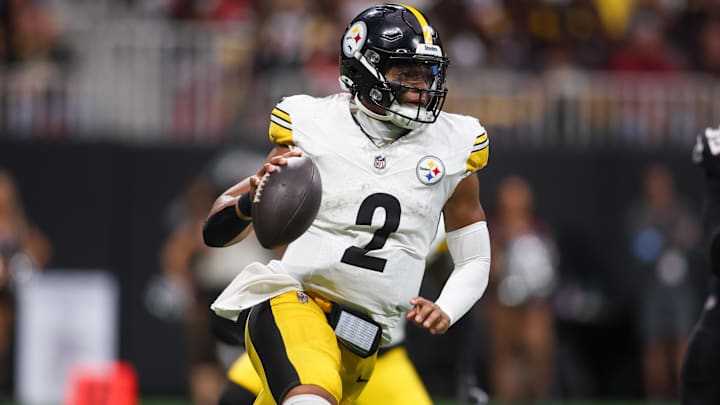 Sep 8, 2024; Atlanta, Georgia, USA; Pittsburgh Steelers quarterback Justin Fields (2) scrambles against the Atlanta Falcons in the fourth quarter at Mercedes-Benz Stadium.