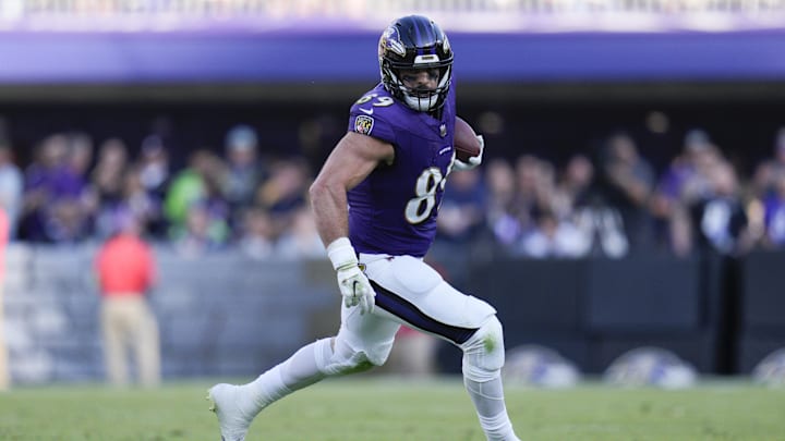 Nov 5, 2023; Baltimore, Maryland, USA;  Baltimore Ravens tight end Mark Andrews (89) runs with the ball against the Seattle Seahawks during the third quarter at M&T Bank Stadium.