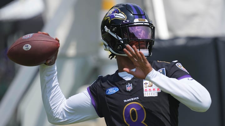 Jul 23, 2025; Owings Mills, MD, USA; Baltimore Ravens quarterback Lamar Jackson (8) warms up during training camp at Under Armour Performance Center. Mandatory Credit: Mitch Stringer-Imagn Images