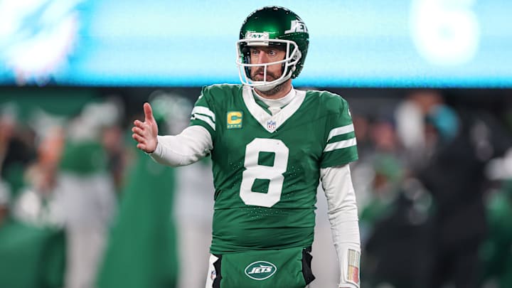 Jan 5, 2025; East Rutherford, New Jersey, USA; New York Jets quarterback Aaron Rodgers (8) gestures towards the Miami Dolphins bench during the second half at MetLife Stadium.