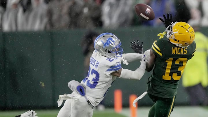 Green Bay Packers wide receiver Dontayvion Wicks (13) is unable to make a catch inbounds while bing covered by Detroit Lions cornerback Carlton Davis III (23) during the fourth quarter of their game Sunday, November 3, 2024 at Lambeau Field in Green Bay, Wisconsin. The Detroit Lions beat the Green Bay Packers 24-14.
