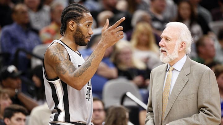 A young Kawhi Leonard and Gregg Popovich