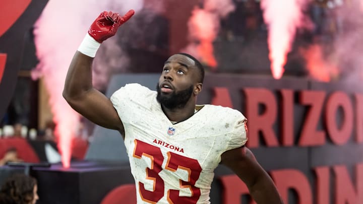 Sep 25, 2025; Glendale, Arizona, USA; Arizona Cardinals running back Trey Benson (33) against the Seattle Seahawks at State Farm Stadium. Mandatory Credit: Mark J. Rebilas-Imagn Images