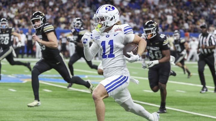 Dec 28, 2024; San Antonio, TX, USA; Brigham Young Cougars wide receiver Parker Kingston (11) returns a punt for a touchdown during the second quarter against the Colorado Buffaloes at Alamodome. Mandatory Credit: Troy Taormina-Imagn Images Dec 28, 2024; San Antonio, TX, USA; Brigham Young Cougars wide receiver Parker Kingston (11) returns a punt for a touchdown during the second quarter against the Colorado Buffaloes at Alamodome. Mandatory Credit: Troy Taormina-Imagn Images