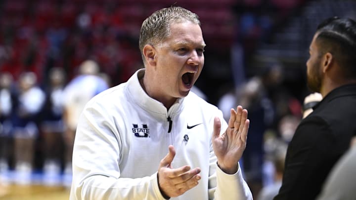 Mar 20, 2026; San Diego, CA, USA; Utah State Aggies head coach Jerrod Calhoun reacts after defeating the Villanova Wildcats in a first round game of the men's 2026 NCAA Tournament at Viejas Arena. Mandatory Credit: Denis Poroy-Imagn Images