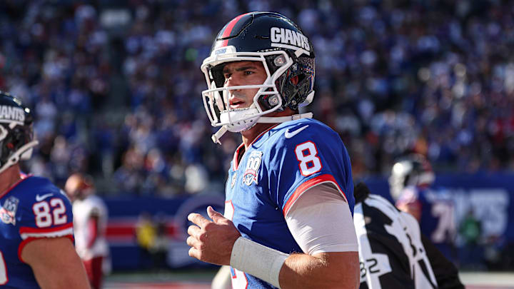 Nov 3, 2024; East Rutherford, New Jersey, USA; New York Giants quarterback Daniel Jones (8) runs of fetch field after throwing a touchdown pass during the first half against the Washington Commanders at MetLife Stadium. Mandatory Credit: Vincent Carchietta-Imagn Images
