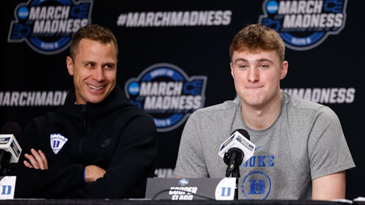 Head coach Jon Scheyer and Cooper Flagg #2 of the Duke Blue Devils react during their press conference ahead of the Elite Eight round of the men's NCAA basketball tournament at Prudential Center on March 28, 2025 in Newark, New Jersey. Head coach Jon Scheyer and Cooper Flagg #2 of the Duke Blue Devils react during their press conference ahead of the Elite Eight round of the men's NCAA basketball tournament at Prudential Center on March 28, 2025 in Newark, New Jersey.