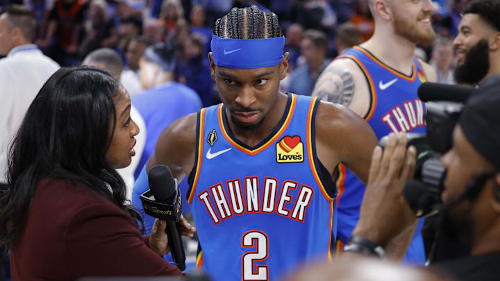 Oct 21, 2025; Oklahoma City, Oklahoma, USA; Oklahoma City Thunder guard Shai Gilgeous-Alexander (2) is interviewed by media at the end of a double overtime win against the Houston Rockets at Paycom Center. Mandatory Credit: Alonzo Adams-Imagn Images