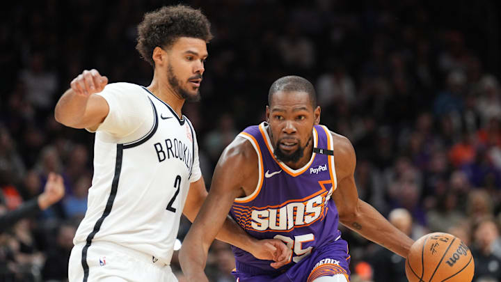 Nov 27, 2024; Phoenix, Arizona, USA; Phoenix Suns forward Kevin Durant (35) drives against Brooklyn Nets forward Cameron Johnson (2) during the first half at Footprint Center. Mandatory Credit: Joe Camporeale-Imagn Images Nov 27, 2024; Phoenix, Arizona, USA; Phoenix Suns forward Kevin Durant (35) drives against Brooklyn Nets forward Cameron Johnson (2) during the first half at Footprint Center. Mandatory Credit: Joe Camporeale-Imagn Images