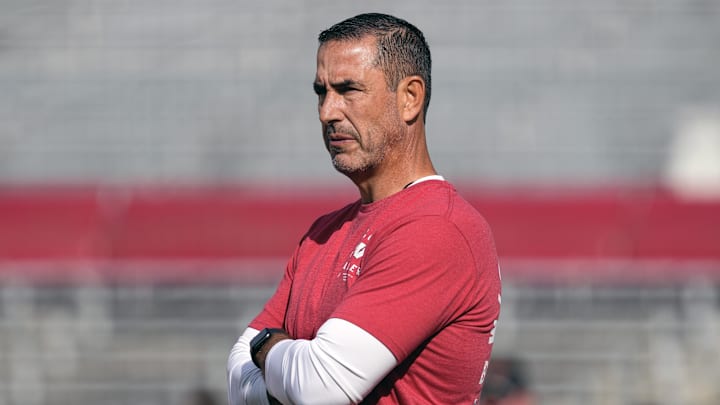 Sep 20, 2025; Madison, Wisconsin, USA;  Wisconsin Badgers head coach Luke Fickell looks on during warm-ups prior to the game against the Maryland Terrapins at Camp Randall Stadium.