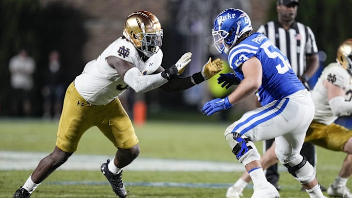 Sep 30, 2023; Durham, North Carolina, USA; Notre Dame Fighting Irish defensive lineman Nana Osafo-Mensah (31) against Duke Blue Devils offensive lineman Brian Parker II (53) during the second half at Wallace Wade Stadium. Mandatory Credit: Jim Dedmon-Imagn Images