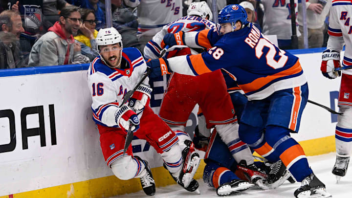 Apr 9, 2024; Elmont, New York, USA; New York Islanders defenseman Alexander Romanov (28) checks New