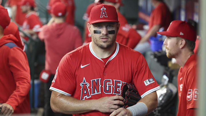 Apr 12, 2025; Houston, Texas, USA; Los Angeles Angels right fielder Mike Trout (27) walks in the dugout before the game against the Houston Astros at Daikin Park. Mandatory Credit: Troy Taormina-Imagn Images