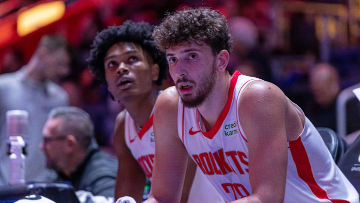 Jan 12, 2024; Detroit, Michigan, USA; Houston Rockets center Alperen Sengun (28) and forward Amen Thompson (1) sit on the sidelines on a play stoppage against the Detroit Pistons during the in the first half at Little Caesars Arena. Mandatory Credit: David Reginek-Imagn Images