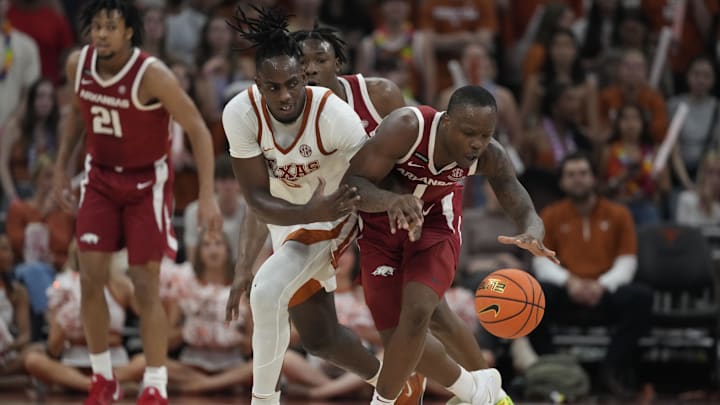Feb 5, 2025; Austin, Texas, USA; Arkansas Razorbacks guard Johnell Davis (1) and Texas Longhorns forward Arthur Kaluma (6) battle for the loose ball during the second half at Moody Center. Mandatory Credit: Scott Wachter-Imagn Images
