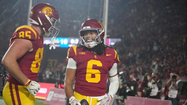 Nov 29, 2025; Los Angeles, California, USA; Southern California Trojans wide receiver Makai Lemon (6) celebrates with tight end Walker Lyons (85) after catching a 32-yard touchdown pass against the UCLA Bruins in the second half at United Airlines Field at Los Angeles Memorial Coliseum. Mandatory Credit: Kirby Lee-Imagn Images