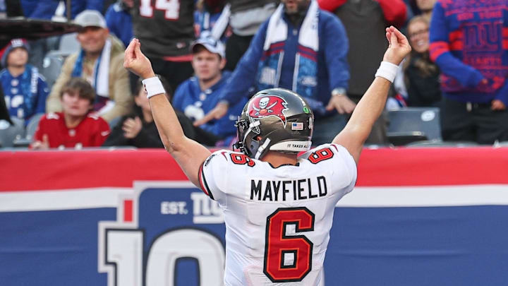 Nov 24, 2024; East Rutherford, New Jersey, USA; Tampa Bay Buccaneers quarterback Baker Mayfield (6) gestures after scoring a rushing touchdown during the first half against the New York Giants at MetLife Stadium. Mandatory Credit: Vincent Carchietta-Imagn Images Nov 24, 2024; East Rutherford, New Jersey, USA; Tampa Bay Buccaneers quarterback Baker Mayfield (6) gestures after scoring a rushing touchdown during the first half against the New York Giants at MetLife Stadium. Mandatory Credit: Vincent Carchietta-Imagn Images