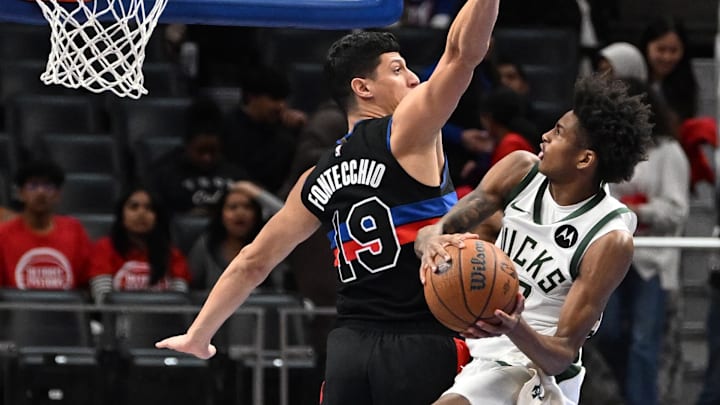Milwaukee Bucks guard AJ Johnson drives to the basket against Detroit Pistons forward Simone Fontecchio in the fourth quarter at Little Caesars Arena on Tuesday.