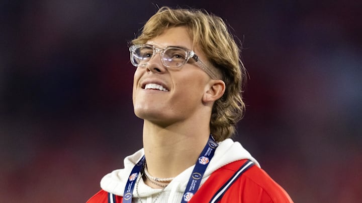 Jan 8, 2026; Glendale, AZ, USA; Mississippi Rebels former quarterback Jaxson Dart in attendance against the Miami Hurricanes during the 2026 Fiesta Bowl and semifinal game of the College Football Playoff at State Farm Stadium. Mandatory Credit: Mark J. Rebilas-Imagn Images Jan 8, 2026; Glendale, AZ, USA; Mississippi Rebels former quarterback Jaxson Dart in attendance against the Miami Hurricanes during the 2026 Fiesta Bowl and semifinal game of the College Football Playoff at State Farm Stadium. Mandatory Credit: Mark J. Rebilas-Imagn Images