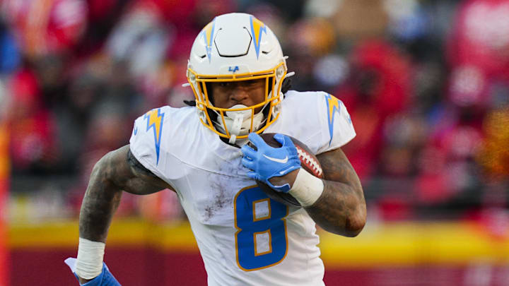 Dec 14, 2025; Kansas City, Missouri, USA; Los Angeles Chargers running back Omarion Hampton (8) runs the ball during the second half against the Kansas City Chiefs at GEHA Field at Arrowhead Stadium. 