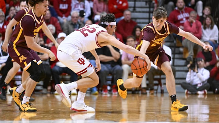 Indiana Hoosiers guard Trey Galloway (32) and Minnesota Golden Gophers guard Brennan Rigsby (24) go after a loose ball during the second half at Simon Skjodt Assembly Hall. Indiana Hoosiers guard Trey Galloway (32) and Minnesota Golden Gophers guard Brennan Rigsby (24) go after a loose ball during the second half at Simon Skjodt Assembly Hall.