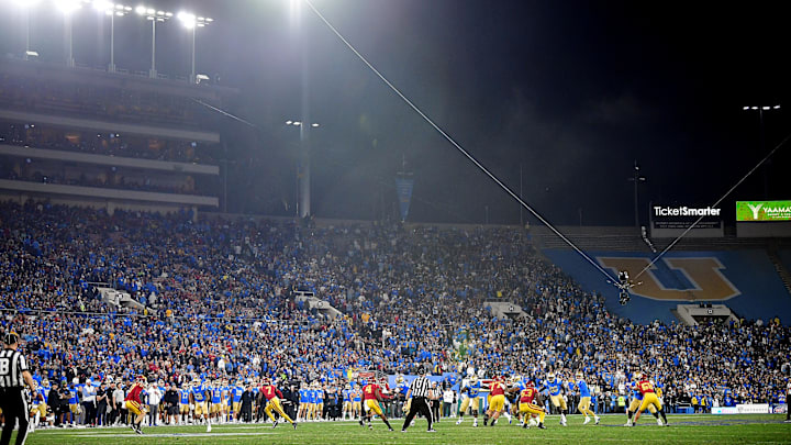 Nov 19, 2022; Pasadena, California, USA; UCLA Bruins quarterback Dorian Thompson-Robinson (1) drops back to pass against the Southern California Trojans during the second half at the Rose Bowl. Mandatory Credit: Gary A. Vasquez-Imagn Images